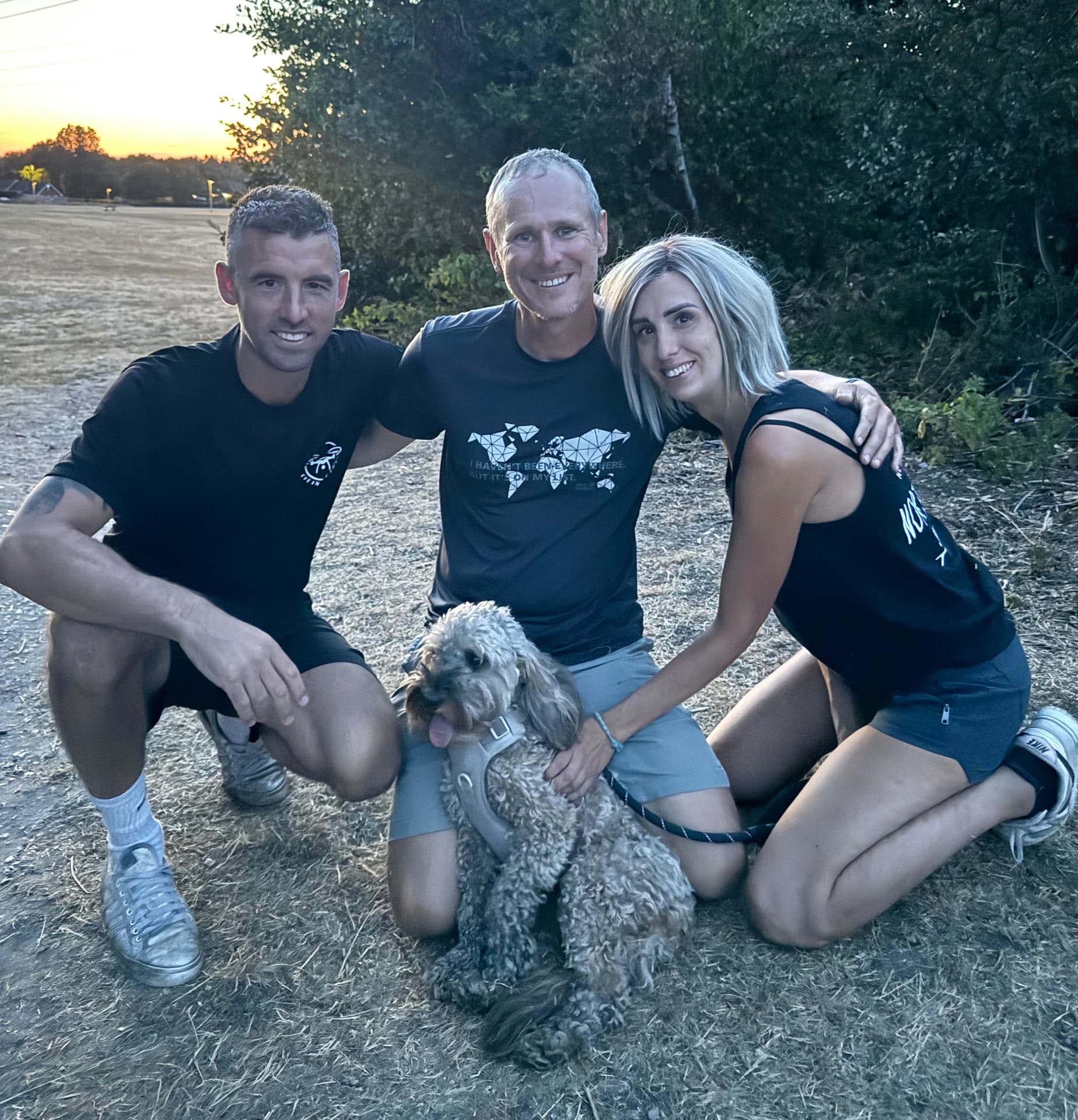 Eye In The Sky volunteers with a dog at sunset