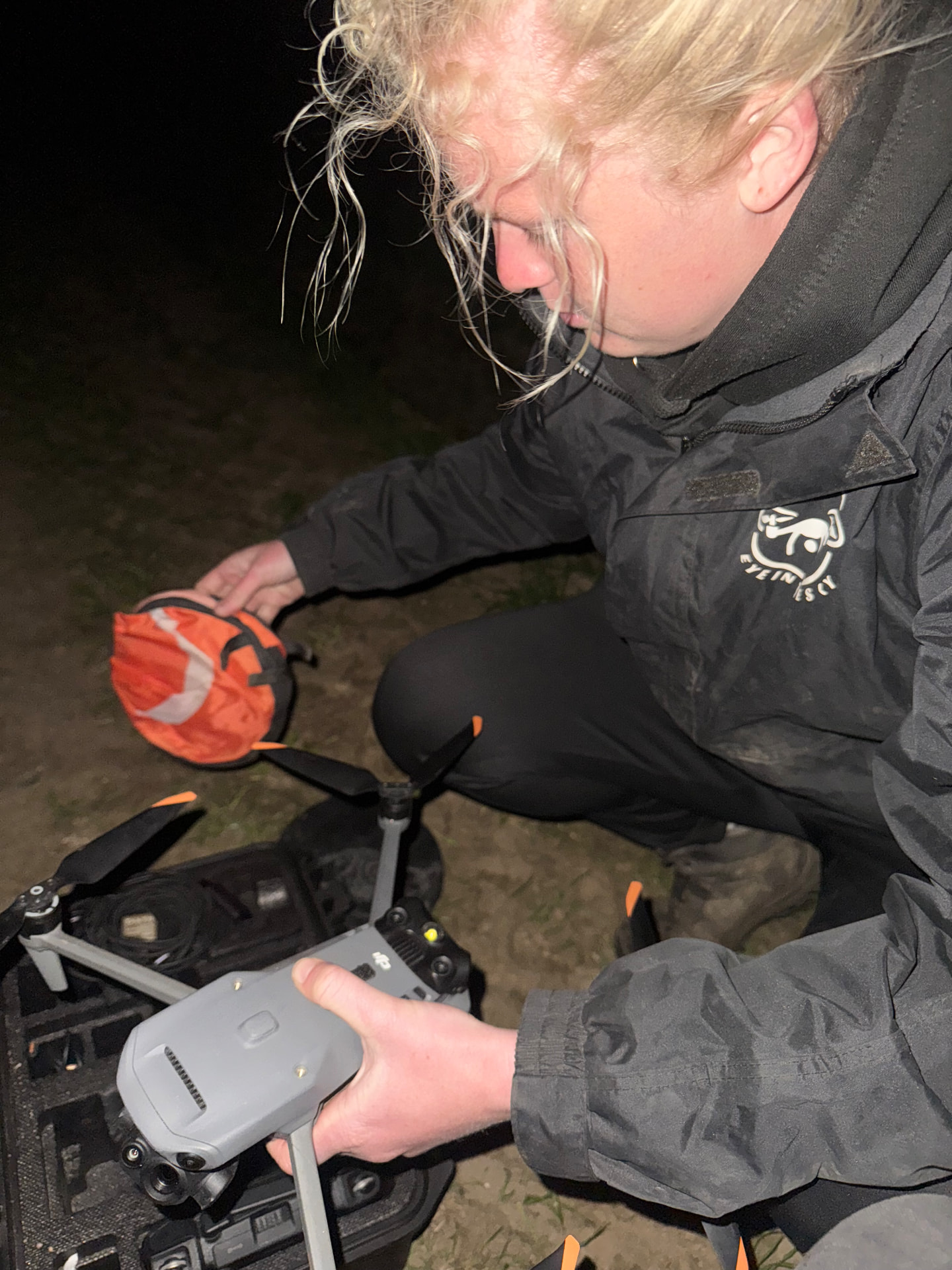 Eye In The Sky drone operator preparing a thermal drone at night